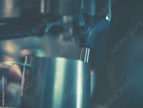 Barista using coffee machine; close-up