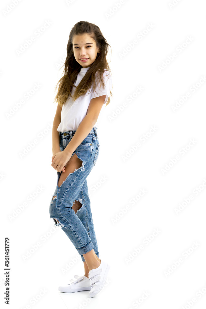 Beautiful teen girl in jeans with holes. Beautiful teen girl in jeans with holes.