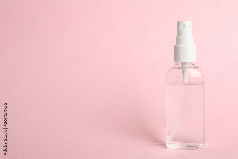 Antiseptic spray on pink background. Space for text Antiseptic spray on pink background. Space for text