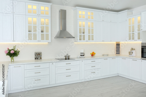 Elegant interior of new kitchen with stylish furniture © New Africa
