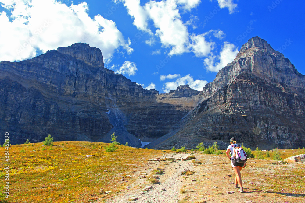 Woman / female hiker is climbing the steep hill on Sentinel hike / trail in Moraine Lake area, Banff National Park, AB.