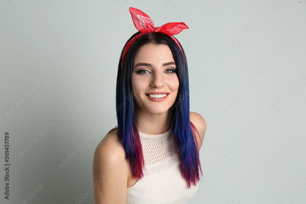Young woman with bright dyed hair on light background Young woman with bright dyed hair on light background