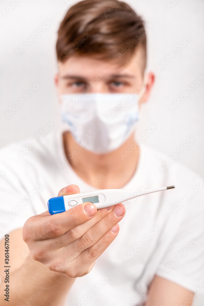 Young Man with a Thermometer Young Man with a Thermometer