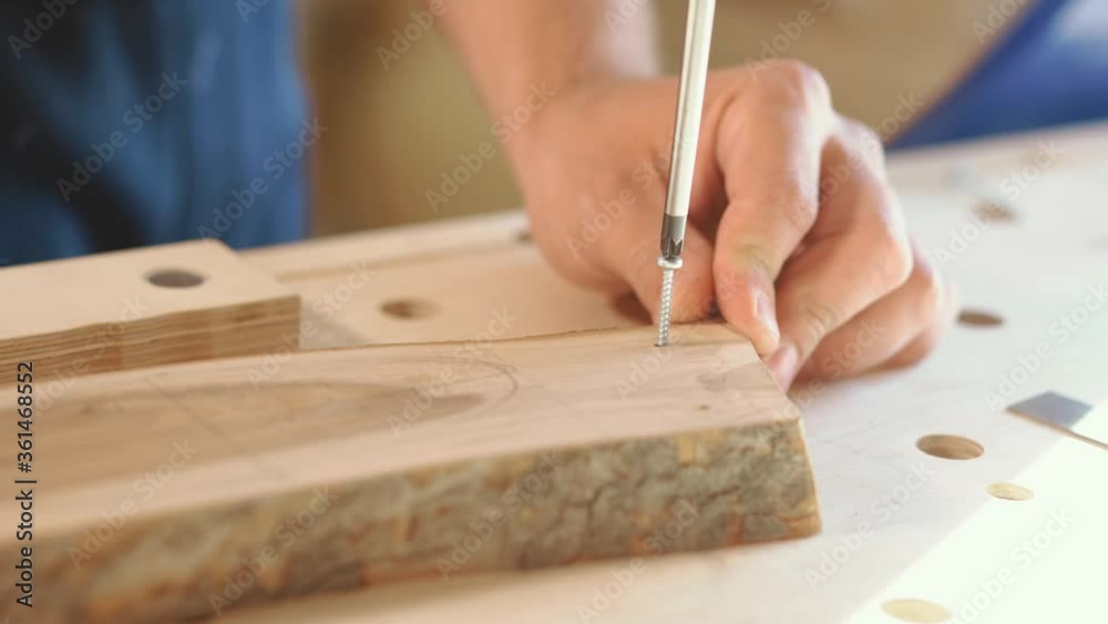 Turn-screw and screw on wood background. close up Turn-screw and screw on wood background. close up