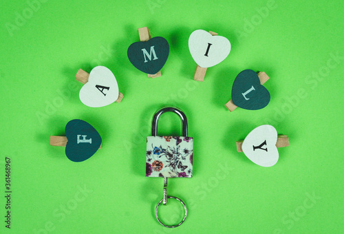 Family concept. Letters that form the word family with close padlock. Stay at home.