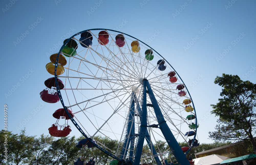 Fototapeta premium A colourful Ferris wheel in the city park.