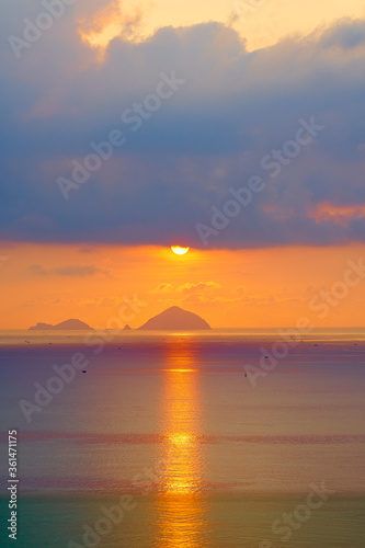 Spectacular sunrise over the tropical island. Calm seascape. © Ruslan Kokarev