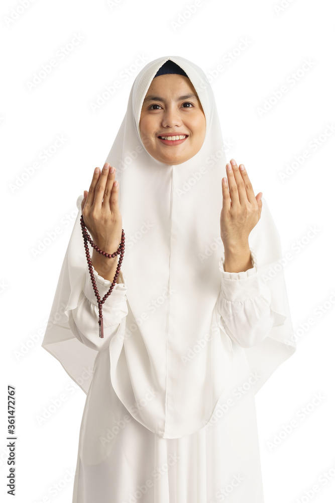 Muslim young woman praying open her arm isolated over white background Muslim young woman praying open her arm isolated over white background