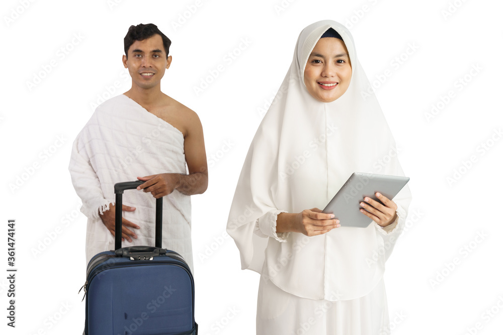 asian muslim couple with white dress going to hajj and umrah