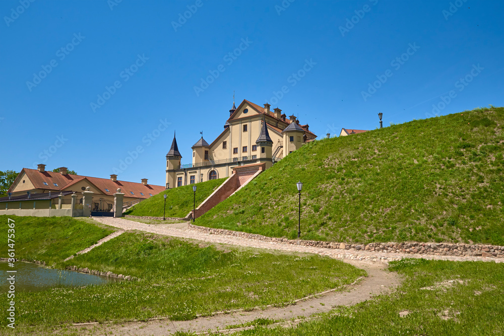 Nesvizh castle in summer day with blue sky. Tourism landmark in Belarus, cultural monument, old fortress
