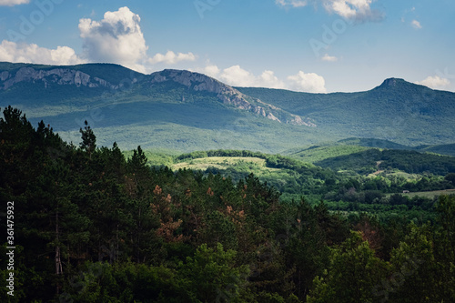 beautiful sky with clouds in the sunny and green hills.