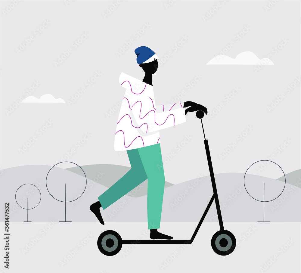 Urban machinery. A young man in a hat on a scooter rides through the park riding an electric scooter. Urban machinery. A young man in a hat on a scooter rides through the park riding an electric scooter.
