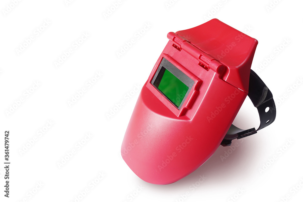 Red plastic protective welding mask helmet on isolated white background.