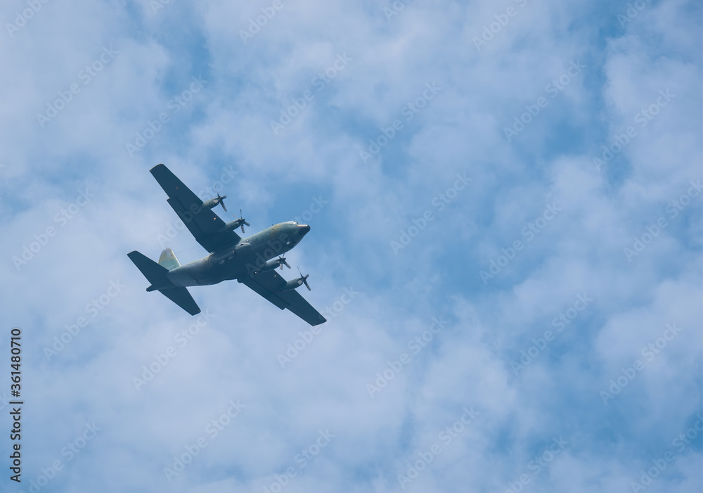 Large military cargo plane flying over Bucharest. Plane prepairing for landing. Large military cargo plane flying over Bucharest. Plane prepairing for landing.