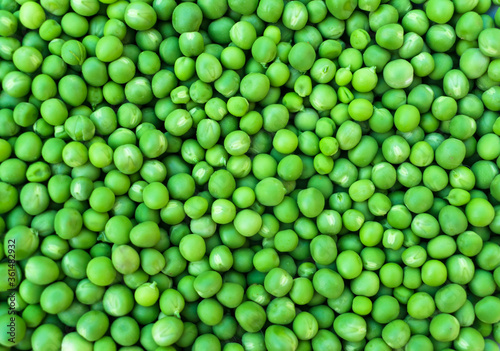 Green young peas natural background.