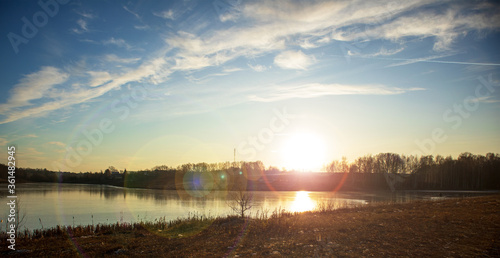 sunset over the river © sergeikorolev