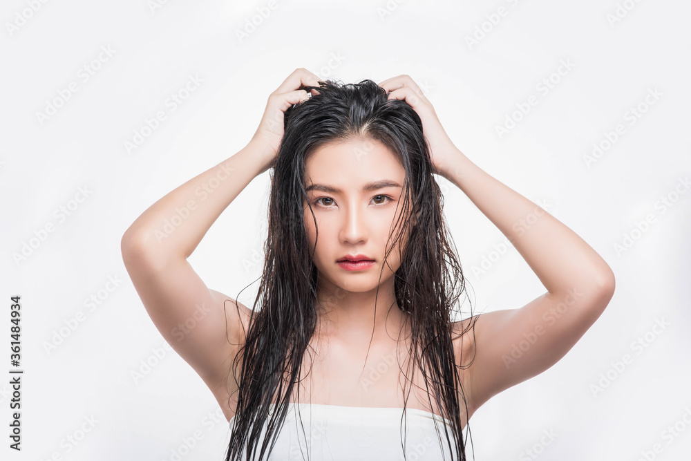 A beautiful, beautiful woman catches her messy hair. A beautiful, beautiful woman catches her messy hair.