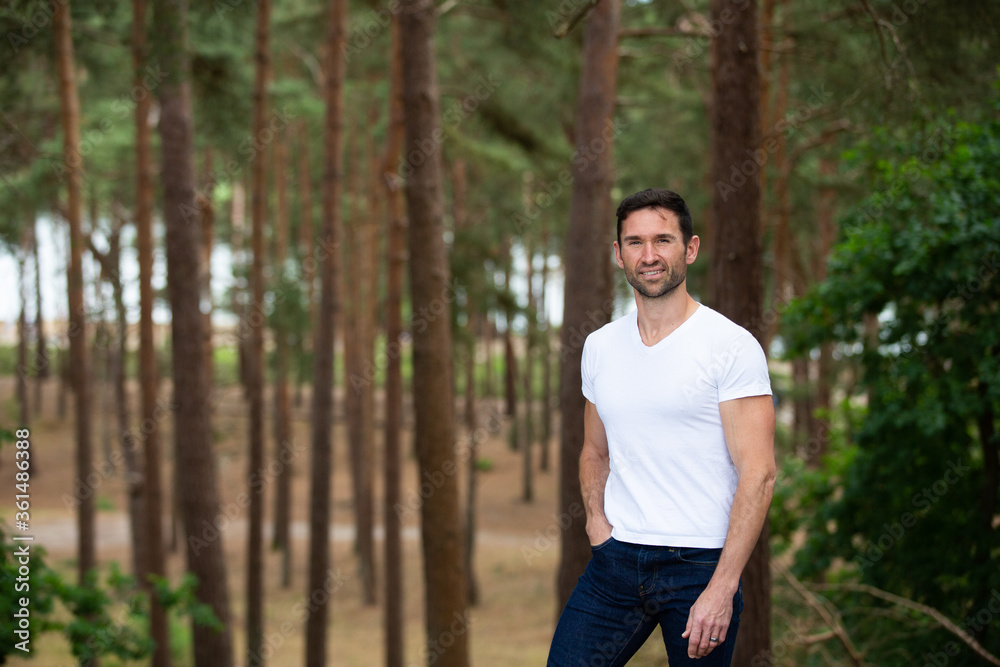 young man in the forest young man in the forest
