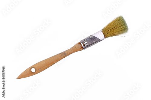 Used narrow wooden paintbrush isolated on white background