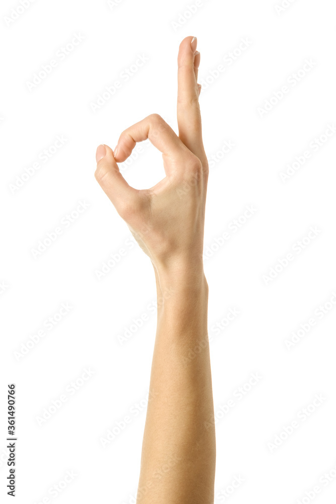 Ok sign. Woman hand gesturing isolated on white Ok sign. Woman hand gesturing isolated on white