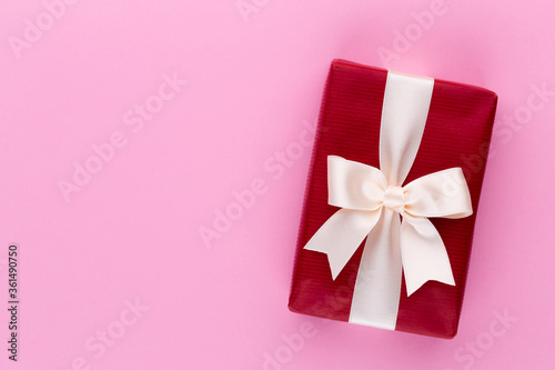 Christmas gift boxes with ribbons on color tabletop.