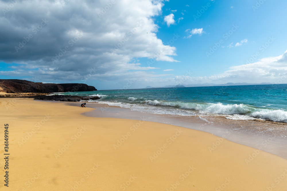 Panorama of beautiful beach and tropical sea of Lanzarote. Canaries