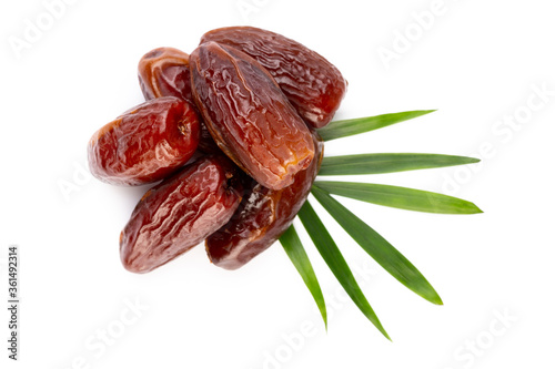 Dry dates isolated on white background. Top view. Flat lay pattern.