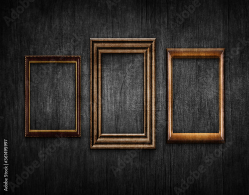 Fototapeta Naklejka Na Ścianę i Meble -  Vintage style wood framework over old black wall background. Space for text. 3d illustration.