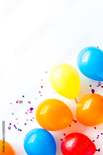 Party concept with colorful balloons on white background top view copy space © 9dreamstudio