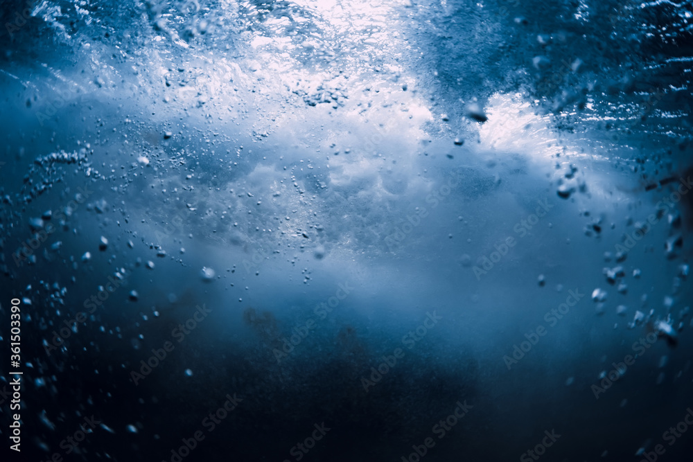 Underwater wave crashing in ocean. Transparent water underwater Underwater wave crashing in ocean. Transparent water underwater