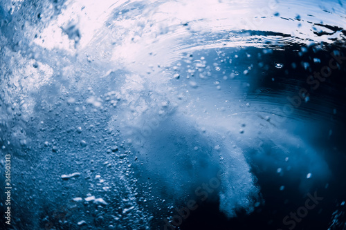 Underwater wave crashing in ocean. Transparent water underwater © artifirsov