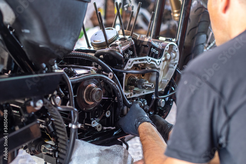 mechanic working on the repair of a motorcycle in the workshop