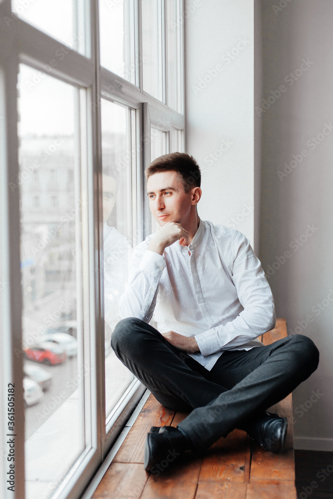 guy (boy or man), businessman, in a white shirt in a photostudio at home guy (boy or man), businessman, in a white shirt in a photostudio at home