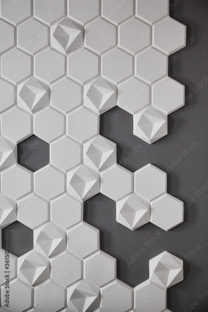 wall background. background texture. wall with textured hexagons. the honeycomb on the wall. gray wall wall background. background texture. wall with textured hexagons. the honeycomb on the wall. gray wall