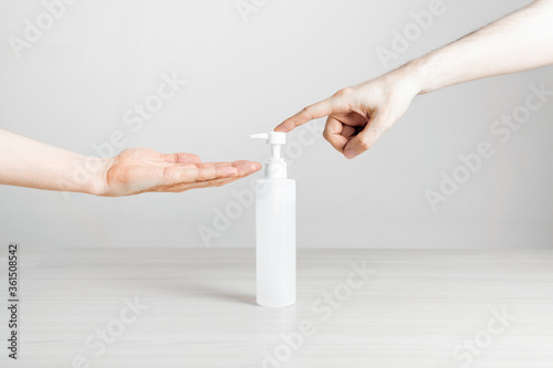 Hand action using disinfectant gel spray on a white background t