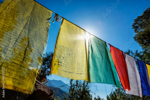 Fotografiet Prayer flags of Tibetan Buddhism with Buddhist mantra on it in Dharamshala monastery temple