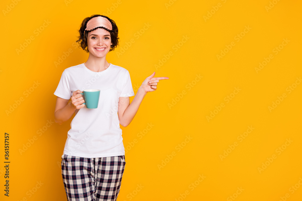 Portrait of her she nice attractive lovely pretty content cheerful cheery brown-haired girl drinking herbal tea showing copy space advert isolated on bright vivid shine vibrant yellow color background Portrait of her she nice attractive lovely pretty content cheerful cheery brown-haired girl drinking herbal tea showing copy space advert isolated on bright vivid shine vibrant yellow color background
