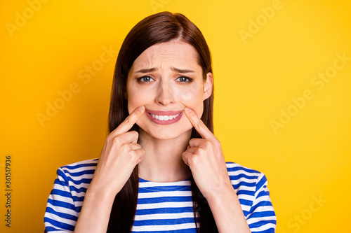 Fototapeta Portrait of frustrated disappointed melancholic woman touch fingers lips mouth h