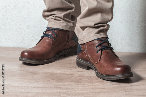 Men's shoes on a wooden floor