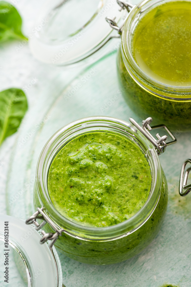 Basil Pesto in Jar. Close Up View. Homemade Healthy Food. Italian Pasta Recipe Basil Pesto in Jar. Close Up View. Homemade Healthy Food. Italian Pasta Recipe