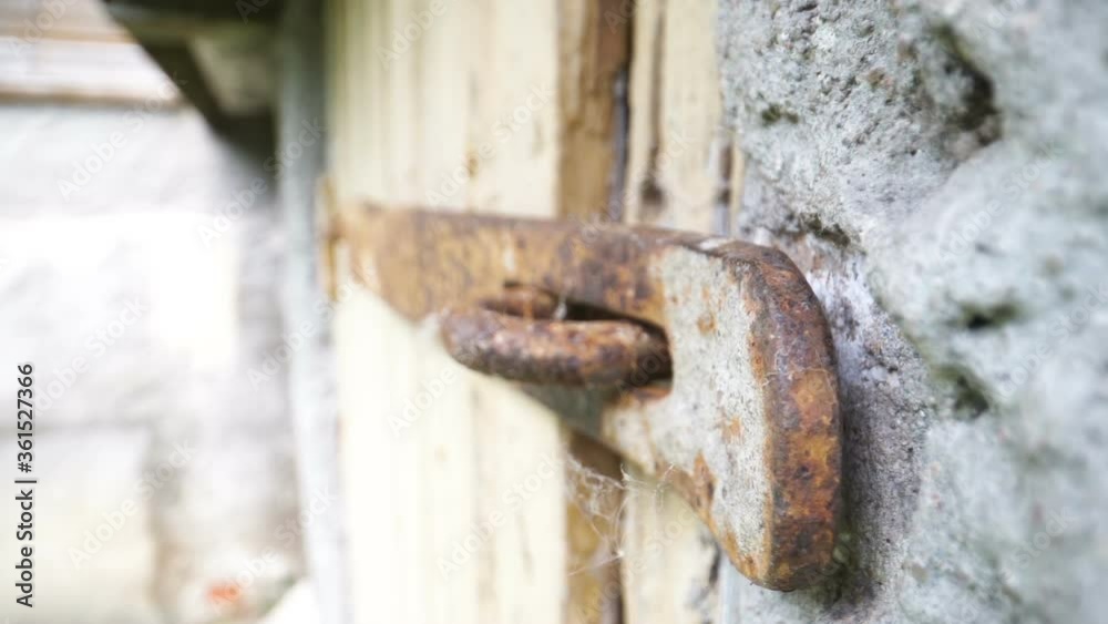 A closer look of the rusty lock of the big gate A closer look of the rusty lock of the big gate