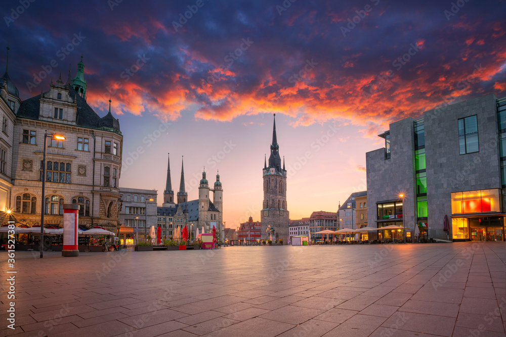 Halle, Germany. Cityscape image of historical downtown of Halle (Saale) with the Red Tower and the Market Place during dramatic sunset.