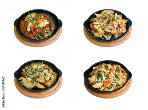 a set of dishes from potatoes on a black frying pan on a white background. isolate
