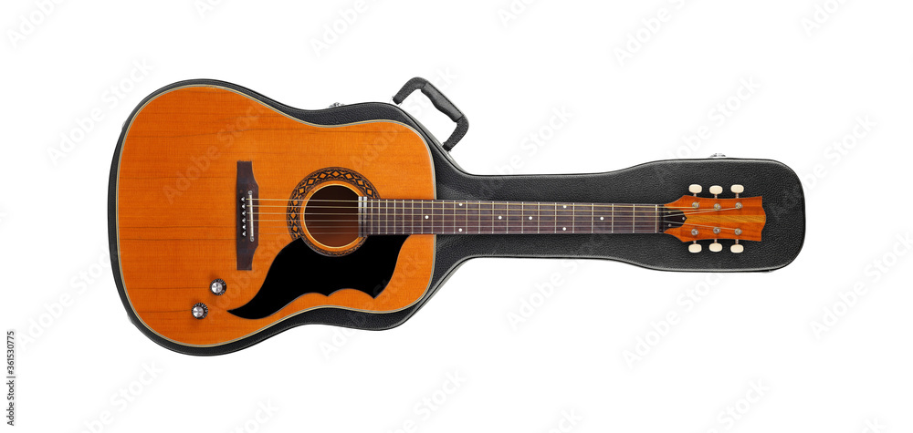 Musical instrument - Vintage western guitar from above on a hard case isolated