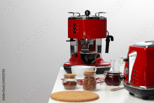 Americano coffee pouring from home coffee machine