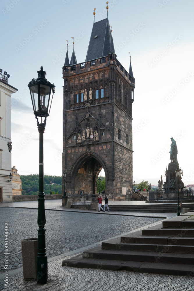 Statue of emperor Charles IV and Old town tower from Krizovnicke square