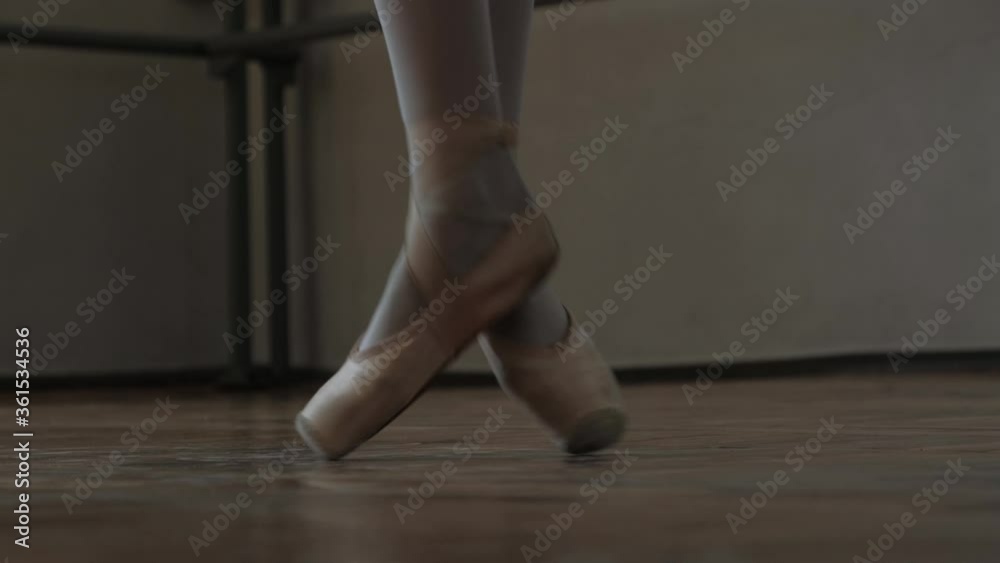 Ballerina dancing in pointe shoes. Legs of a ballerina close-up. Ballerina dancing in pointe shoes. Legs of a ballerina close-up.