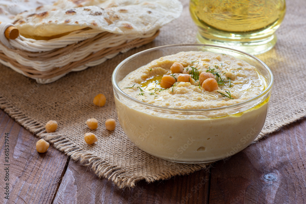 Chickpea hummus on a wooden table Chickpea hummus on a wooden table