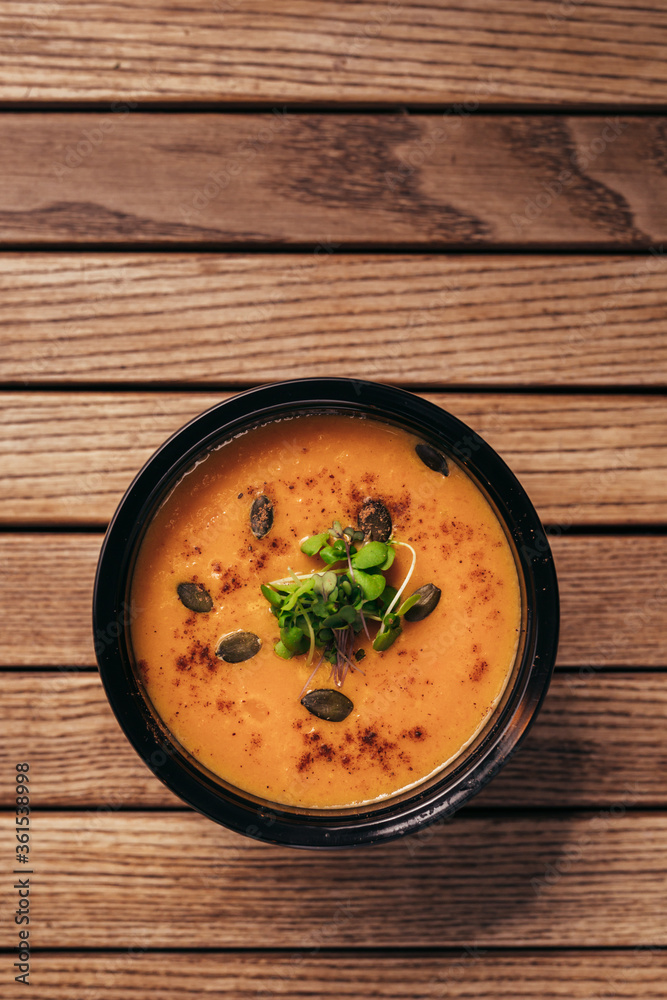 flat lay of cream vegetable soups on wooden table flat lay of cream vegetable soups on wooden table