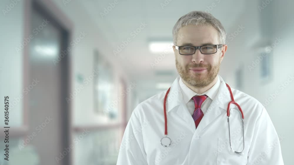 Tired doctor in a hospital hallway Tired doctor in a hospital hallway